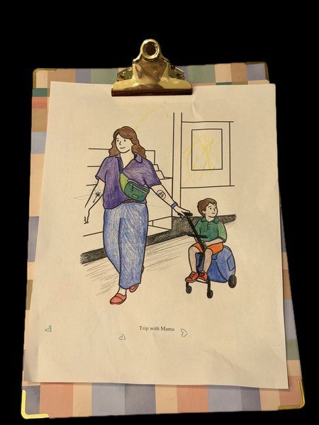 The printed coloring page on a clipboard, colored in by a child — mom in a purple shirt and blue pants, son in green, with a small rainbow scribble at the top of the page.